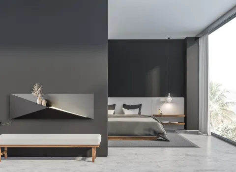 Horizontaler Polygon-Designheizkörper vom Hersteller Bemm in Anthrazit mit LED-Lichtleiste als stilvolles Einrichtungselement im Schlafzimmer.